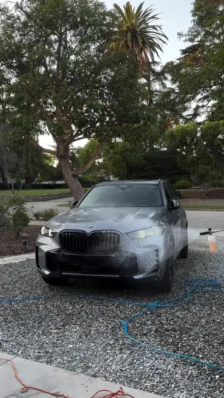 Washing a car in a client's driveway